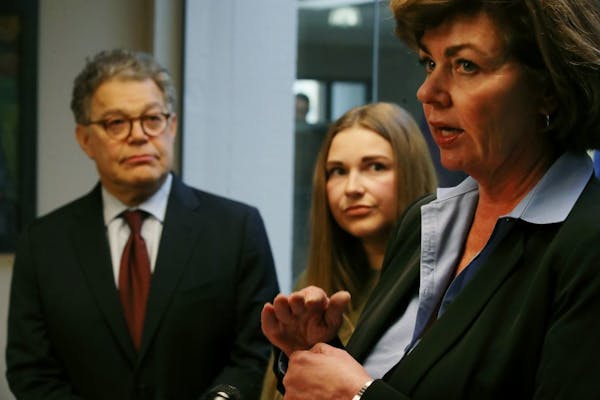 Sen. Al Franken and Abby Honold looked on in October 2017 as Beth Roberts, a retired police officer, talked about legislation aimed toward better trai