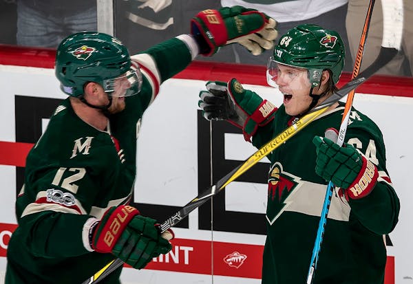 Mikael Granlund (64) celebrated with Eric Staal (12).