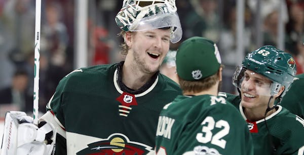 Devan Dubnyk and Alex Stalock celebrated after a victory earlier this month.