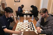 Andrew Tang, left, a Wayzata High School senior, defeated Grandmaster Denes Boros, right, at a tournament in Charlotte, N.C., a victory that helped Ta