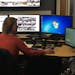 Emergency dispatcher Jo Richmond demonstrates how the new “Text-to-911” service works at the University of Minnesota’s emergency communications 