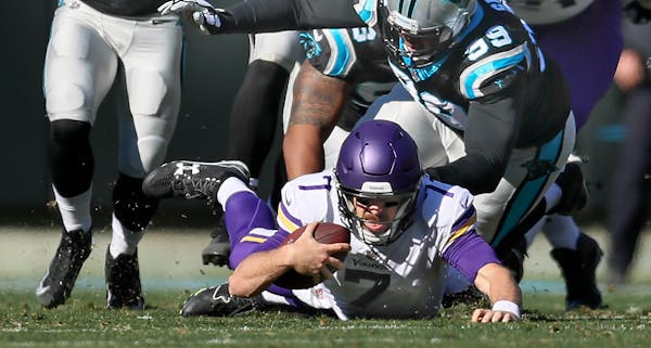 Vikings quarterback Case Keenum hits the turf during Sunday's loss.