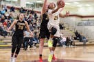 Park Center freshman Adalia McKenzie goes in for a layup against Maple Grove Tuesday night. McKenzie had 17 points in the Pirates' xx-xx victory over 