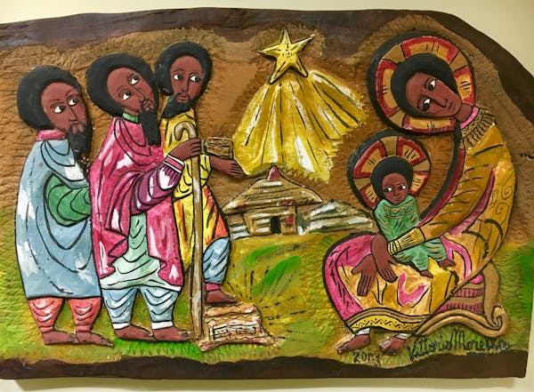 Mildred Turner of Omro, Wis., purchased this Ugandan Nativity scene, created on a wooden plaque, for her collection.