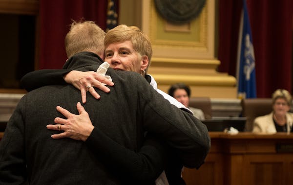 Minneapolis Park Board Commissioner Jon Olson hugged superintendent Jayne Miller before the start of the 2017 City Council meeting where Miller's resi