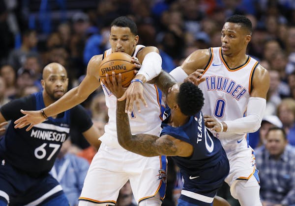Back after missing four games, Wolves guard Jeff Teague (0) was fouled by Thunder guard Andre Roberson in the second quarter Friday.
