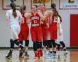 Kari Macura (11) collected high-fives after making a steal and a pass that led to a layup at the buzzer and gave Lakeville North a 43-20 halftime lead