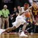 Nebraska's Glynn Watson Jr. (5) drives past Minnesota's Nate Mason (2) during the second half of an NCAA college basketball game in Lincoln, Neb., Tue