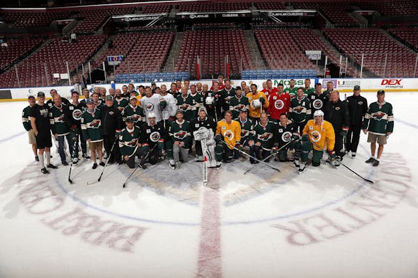Wild players posed with their fathers, brothers, sons or mentors after practice Thursday in Florida.