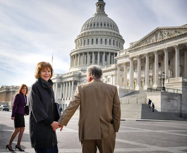Holding hands with her husband, Archie, Sen. Tina Smith walked toward the U.S. Capitol building in the morning sun for her swearing-in ceremony Wednes