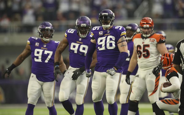 Minnesota Vikings defensive end Brian Robison (96) celebrated his sack of Bengals quarterback Andy Dalton for a six yard loss.