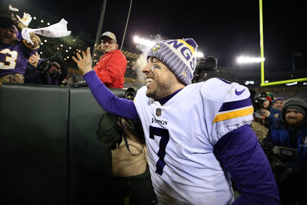 Vikings quarterback Case Keenum tossed his towel to a fan while celebrating the 16-0 win over Green Bay last week.