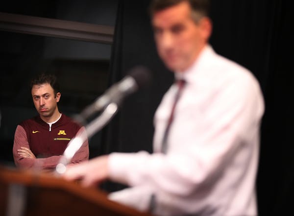 Gophers men's basketball coach Richard Pitino watched as athletic director Mark Coyle spoke about Reggie Lynch at a news conference Friday.