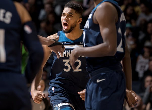 Wolves center Karl-Anthony Towns reacted after throwing down a dunk in the third quarter against the Cavaliers on Monday night. ] CARLOS GONZALEZ � 