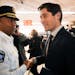 Minneapolis Police Chief Medaria Arradondo shook hands with Minneapolis Mayor Jacob Frey after Frey's arrival at North Market Thursday afternoon.