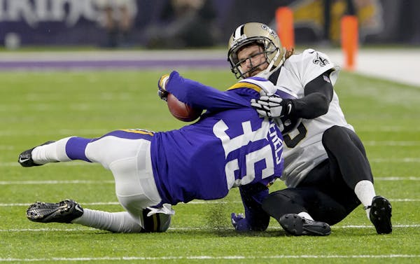 New Orleans Saints punter Thomas Morstead (6) injures his ribs on this touchdown saving tackle of Minnesota Vikings cornerback Marcus Sherels (35) in 