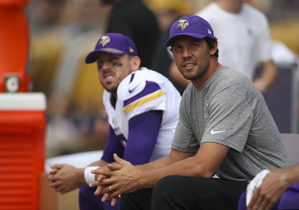 Injured Minnesota Vikings quarterback Sam Bradford, foreground, sat on the bench with his backup, quarterback Case Keenum during the Steelers' first s