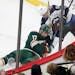 The Minnesota Wild's Marcus Foligno (17) tangles with the Winnipeg Jets Marko Dano (56) in the corner Saturday, Jan. 13, 2018, at the Xcel Energy Cent