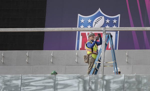 Work went on at U.S. Bank Stadium's field as NFL Senior Director of Events Eric Finkelstein and NFL Field Director Ed Mangan spoke Tuesday about prepa