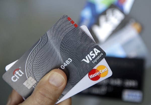 FILE - In this June 15, 2017, file photo, credit cards are displayed in Haverhill, Mass. If you have excellent credit, you can use your credit rating 