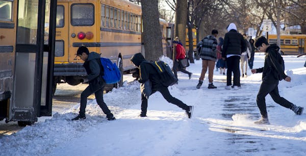 Students ran to their buses at Sanford Middle School in Minneapolis on Tuesday afternoon. The district wants to shift all of its middle schools to a 9