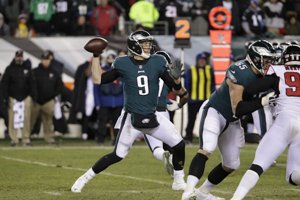 Philadelphia Eagles’ Nick Foles in action during the first half of an NFL divisional playoff football game against the Atlanta Falcons, Saturday, Ja