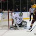 Minnesota Golden Gophers defenseman Tyler Nanne (29) attempts a shot that sails to the right of Michigan State Spartans goalie John Lethemon (31) duri