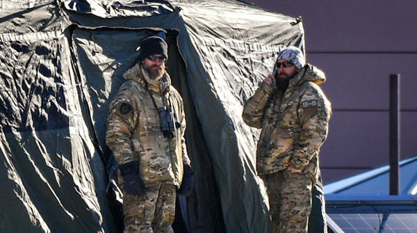Bearded military personnel kept an eye out from a tent on the roof of the Minneapolis Convention Center this week during Super Bowl festivities.