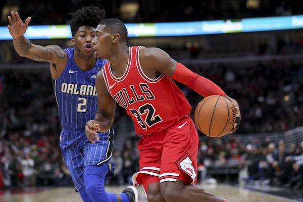 Thee Chicago Bulls' Kris Dunn (32) drives against the Orlando Magic's Elfrid Payton (2) at the United Center in Chicago on December 20, 2017.