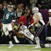 Philadelphia Eagles quarterback Nick Foles (9) got a pass away under pressure from New England Patriots defenders Trey Flowers (98) and Lawrence Guy (