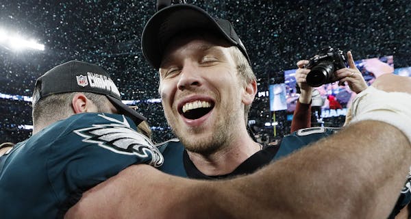 Eagles quarterback Nick Foles (9) joined teammates in celebrating their victory over the New England Patriots in Super Bowl LII at U.S. Bank Stadium i