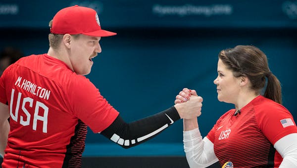 Matt and Becca Hamilton celebrated after beating the Athletes from Russia 9-3 in mixed pairs curling on Thursday, February 8, 2018 at the Gangneung Cu