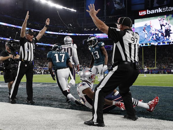 Referees signaled a touchdown after Philadelphia wide receiver Alshon Jeffery made a 34-yard touchdown catch from quarterback Nick Foles in the first 