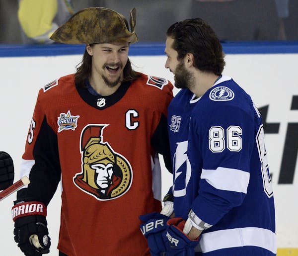 Ottawa defenseman Erik Karlsson, left, came to Saturday’s skills competition dressed as a pirate. Appropriate, as he’ll likely make out like a pir