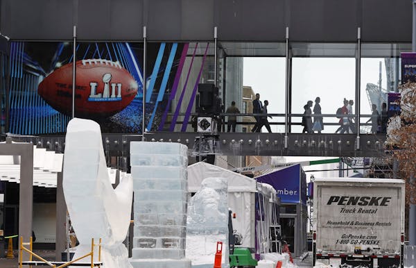 Crowds use the skyway system on the Nicollet Mall in Minneapolis where Super Bowl Live is set up. (AP Photo/Jim Mone)