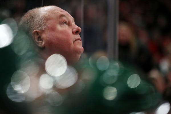 Minnesota Wild head coach Bruce Boudreau watched from the bench