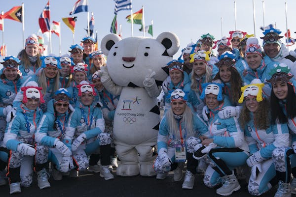 Members of the Finnish Olympic team posed for photos with the Olympic mascot — a white tiger named “Soohorang” — at a welcome ceremony on Wedn