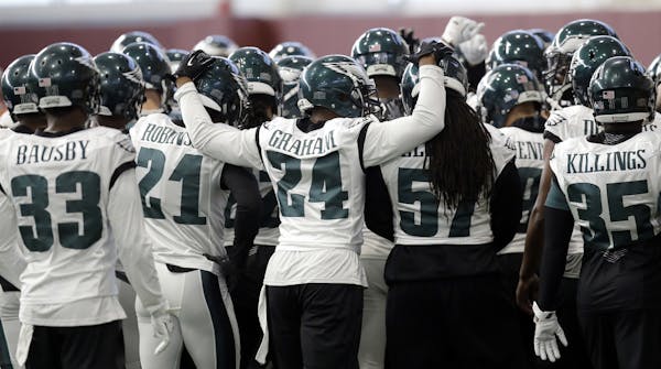 Eagles defensive back Corey Graham embraced a couple teammates during practice Wednesday. The Eagles have shown to be a tight-knit group: “No outsid