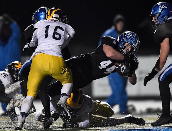 Ty Barron played linebacker and carried the ball for Minnetonka. He scored a touchdown on Nov. 3 vs. Rosemount. (Star Tribune photo by AARON LAVINSKY,