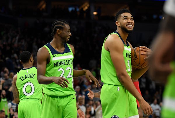 Andrew Wiggins, left, and Karl-Anthony Towns seem to have the Wolves en route to their first playoff berth since 2004, but the team made no moves at t