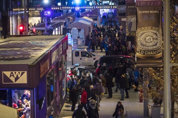 A crowd walked through the Super Bowl Live events on Nicollet Mall on Friday night in Minneapolis.