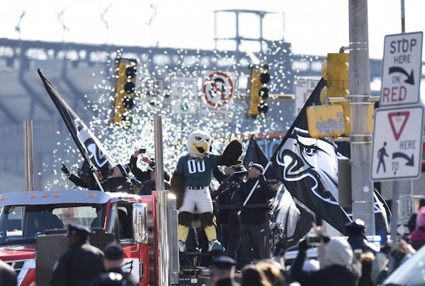 Philadelphia Eagles NFL football team mascot Swoop waves during the Super Bowl LII victory parade, Thursday, Feb 8, 2018, in Philadelphia.