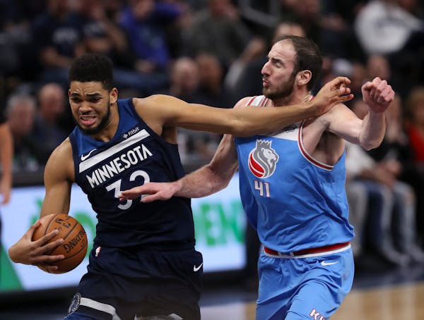 Timberwolves center Karl-Anthony Towns held off Kings center Kosta Koufos, who fouled Towns as he drove to the net in the fourth quarter Sunday. Towns