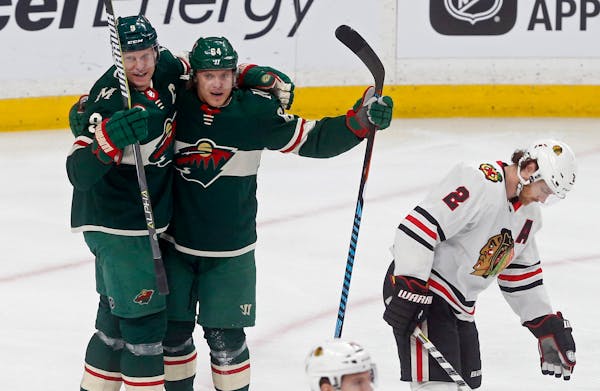 The Blackhawks’ Duncan Keith, right, hung his head and exited after the Wild’s Mikko Koivu, left, scored on a power play and generated a celebrati