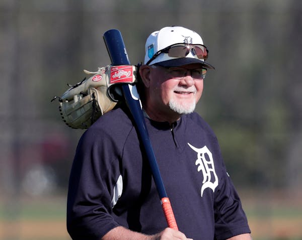 Detroit Tigers manager Ron Gardenhire walks onto the field at baseball spring training camp, Friday, Feb. 16, 2018, in Lakeland, Fla. (AP Photo/Lynne 