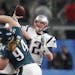 New England Patriots quarterback Tom Brady (12) threw a pass during Super Bowl LII as Beau Allen (94), a Minnetonka native who plays defensive tackle 