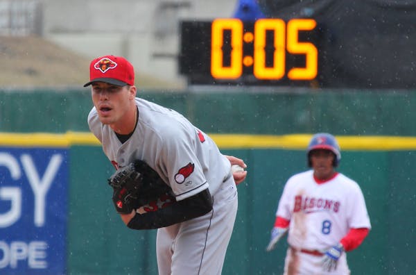 A photo from 2015 shows a 20-second pitch clock behind Rochester Red Wings pitcher Alex Meyer in a Triple-A game against Buffalo.