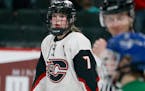 Centennial High Gabbie Hughes (7) had a four-goal game against Eagan during her team's 6-1 win during the Class 2A girls' hockey state tournament semi