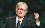 FILE - In this Oct 26, 1994 file photo, Evangelist Billy Graham begins his sermon in Atlanta's Georgia Dome. Graham, who transformed American religiou