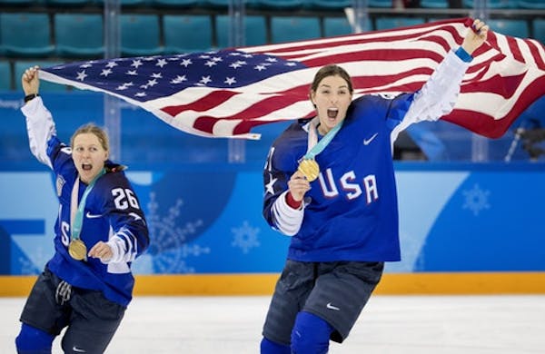 Kendall Coyne (26) and Hilary Knight (21) celebrated at the end of the game.